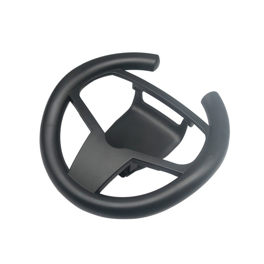 Black steering wheel attachment on a white background