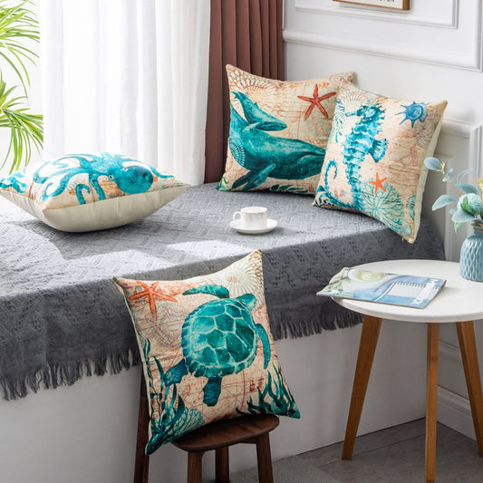 Decorative pillows with marine life patterns on a bed in a bedroom setting.