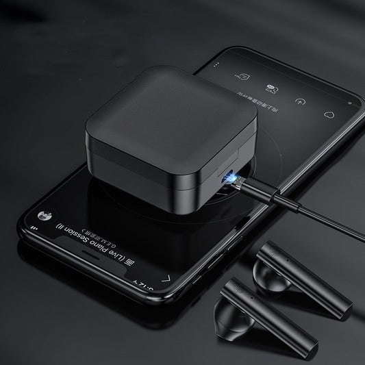 Black wireless earbuds charging case with earbuds on a dark surface