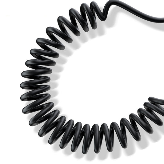 Coiled black cable on a white background