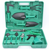 Set of gardening tools in a green case on a white background