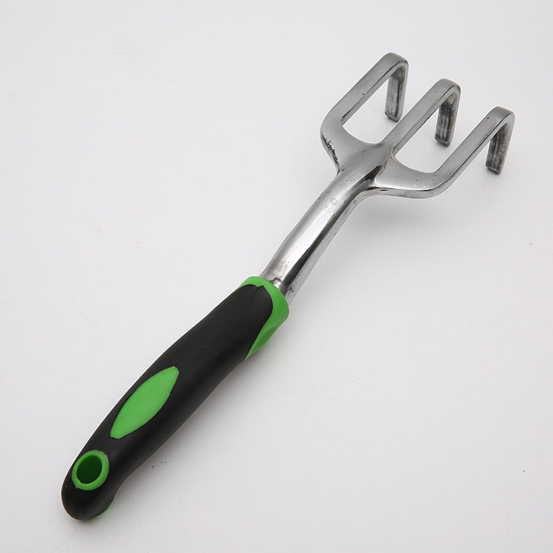 Gardening tool with a black and green handle on a white background
