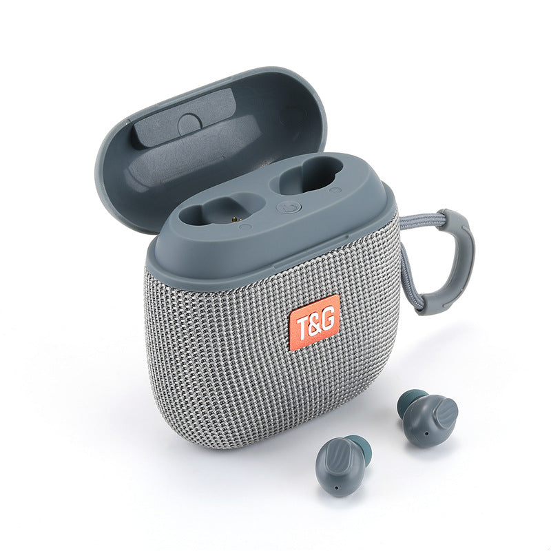Gray wireless earbuds with charging case on a white background