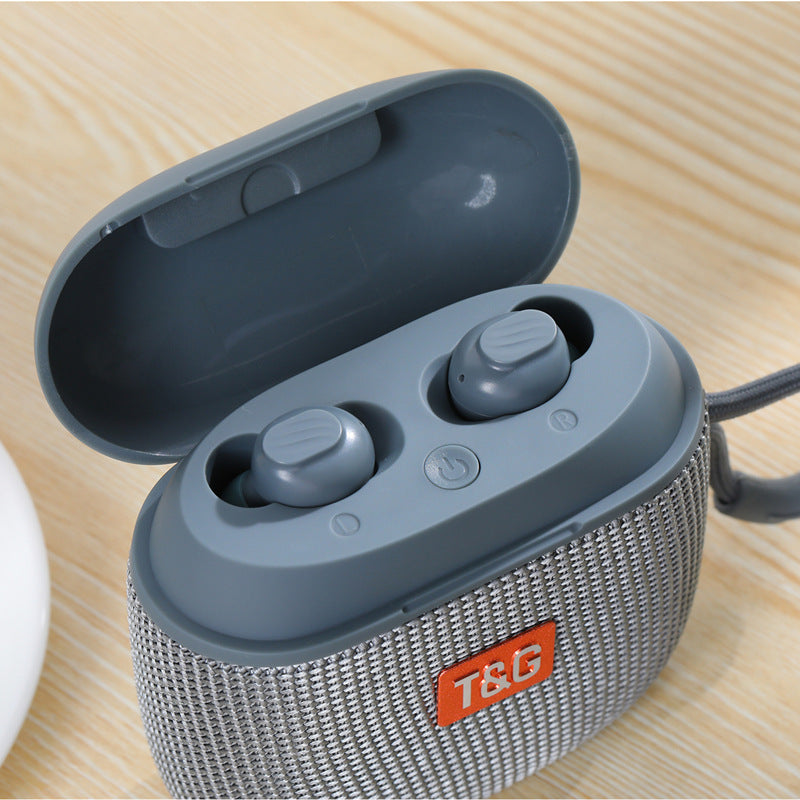Gray wireless earbuds in a mesh case on a wooden surface with 'T&G' branding.