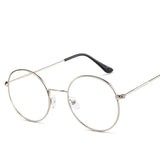 Round metal eyeglasses on a white background