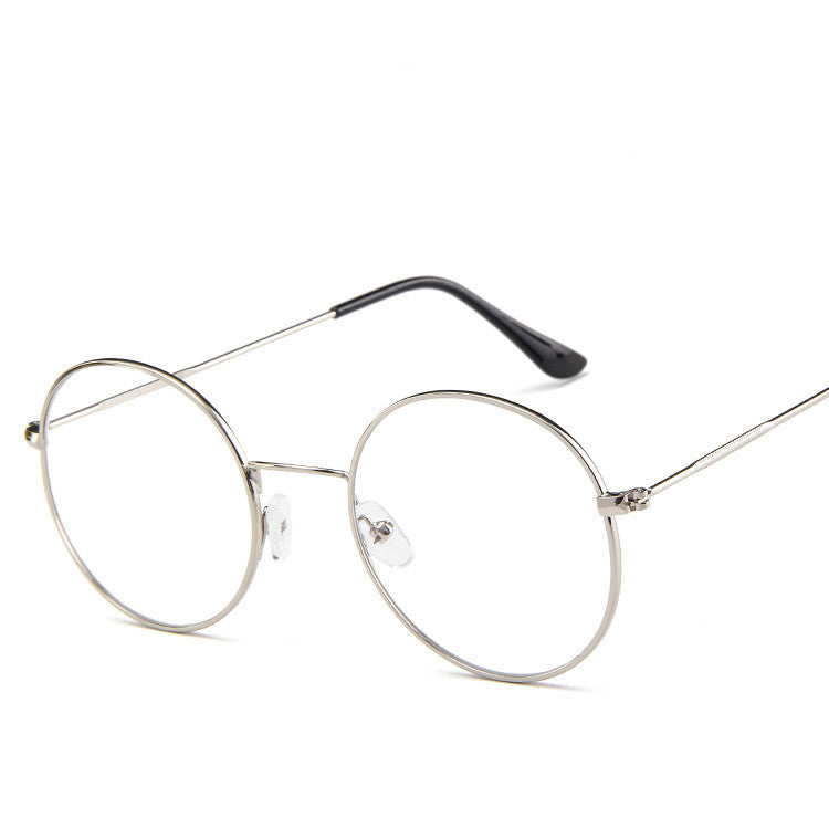 Round metal eyeglasses on a white background