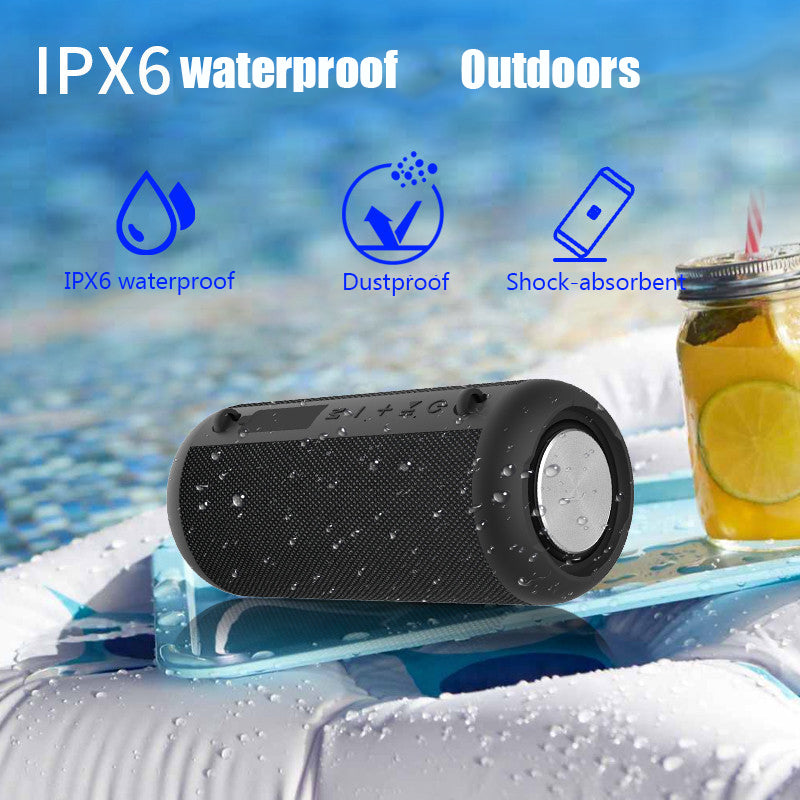 Black waterproof Bluetooth speaker on a pool float with pool and drink in the background