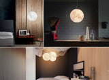 Collage of interior design elements including a moon-shaped lamp, bed, and decor items.