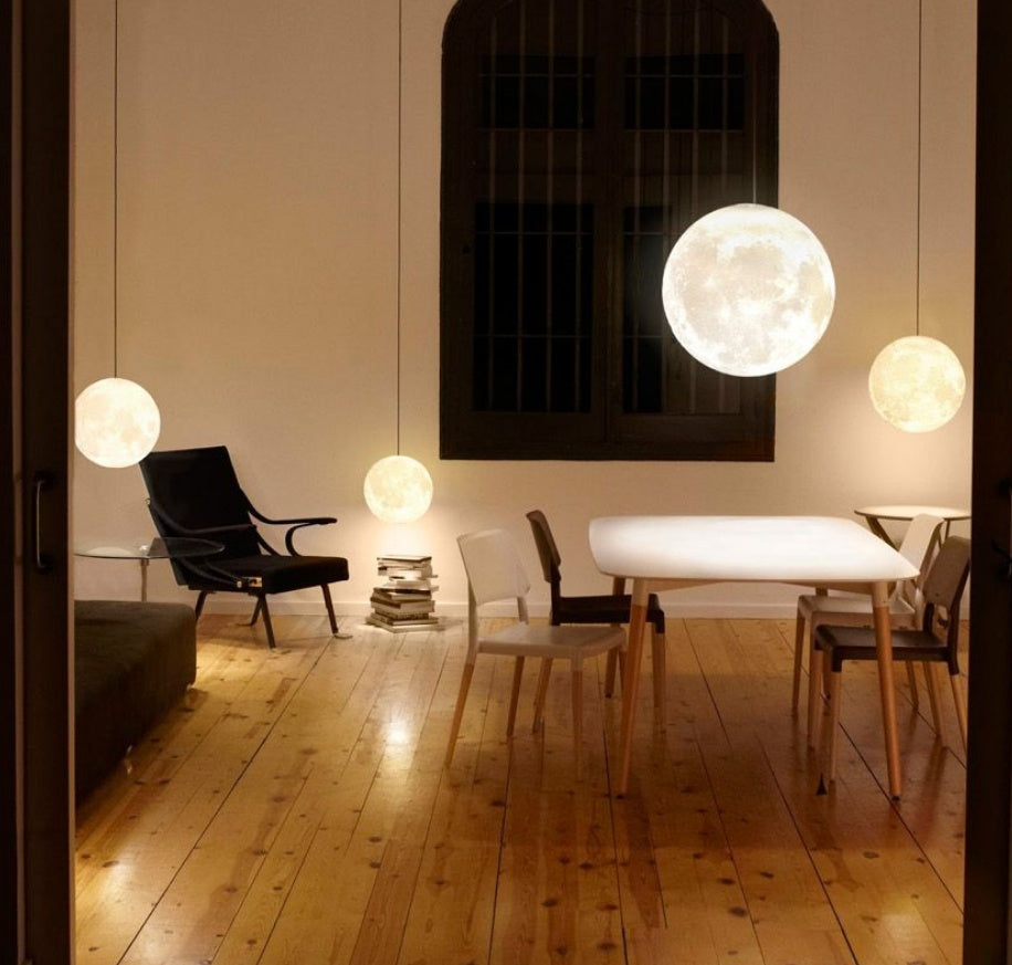Modern dining room with round pendant lights and wooden flooring