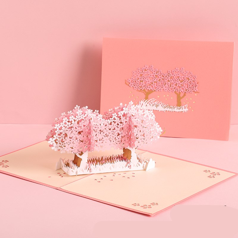 3D pop-up card with cherry blossom trees on a pink background