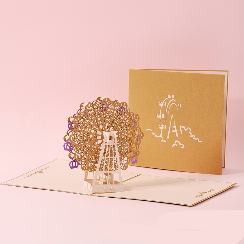 3D pop-up card with a Ferris wheel design on a pink background