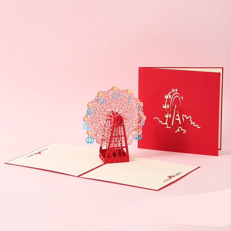 Pop-up card with Ferris wheel design on a pink background