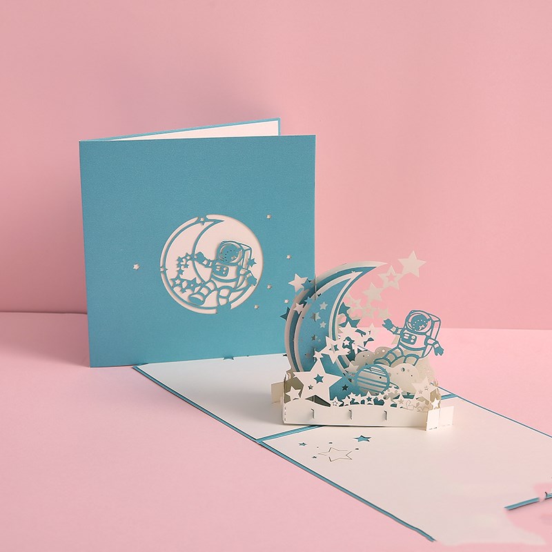 Pop-up card with astronaut design on a pink background