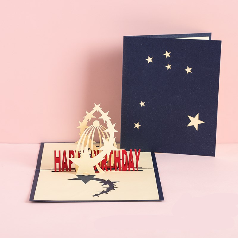 Pop-up birthday card with star design on a pink background