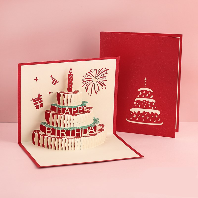 Pop-up birthday card with 3D cake design on a pink background