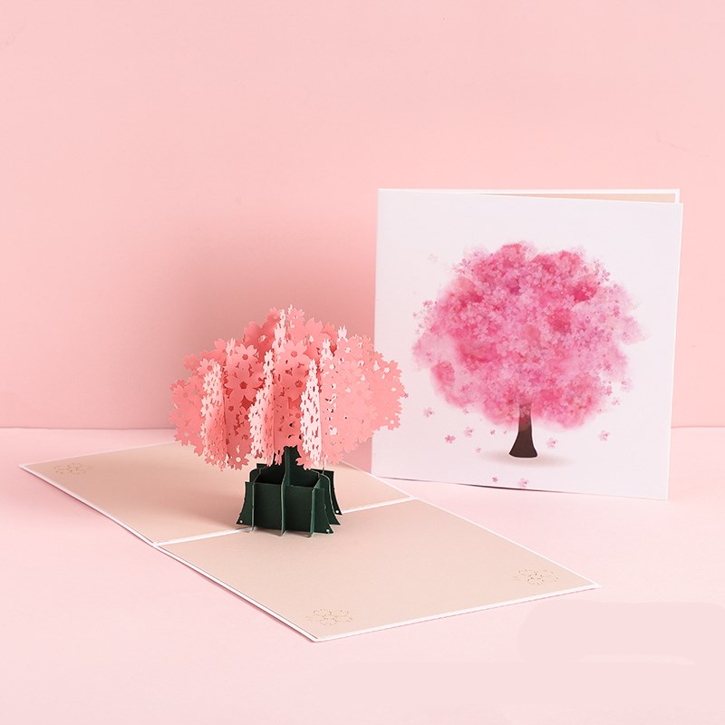 3D pop-up card with cherry blossom tree design on a pink background