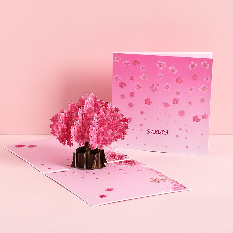 3D pop-up card with cherry blossom tree design on a pink background