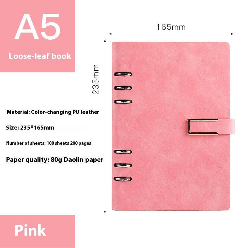 Pink loose-leaf book with dimensions and material details on a white background