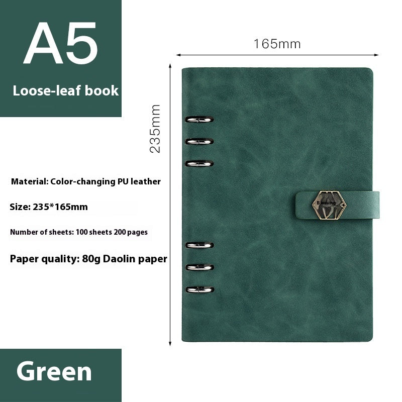 Green loose-leaf book with dimensions and material details on a white background