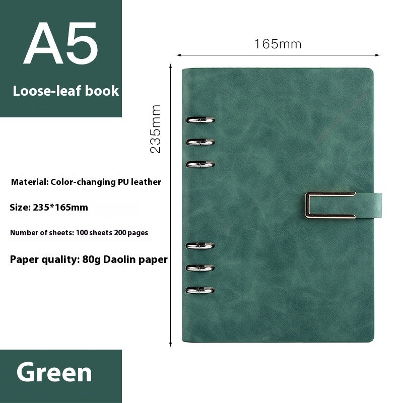 Green loose-leaf book with dimensions and material details on a white background