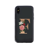 Phone case with floral letter 'F' design on a black background