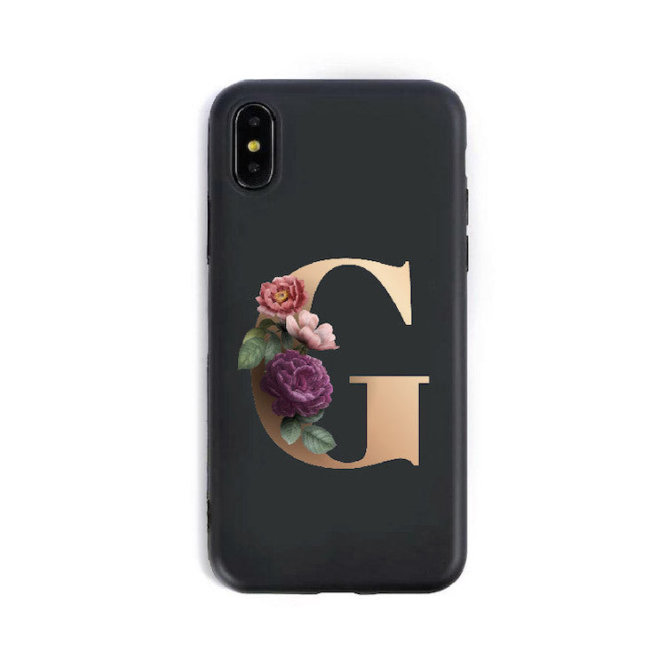 Phone case with floral design and letter 'G' on a black background