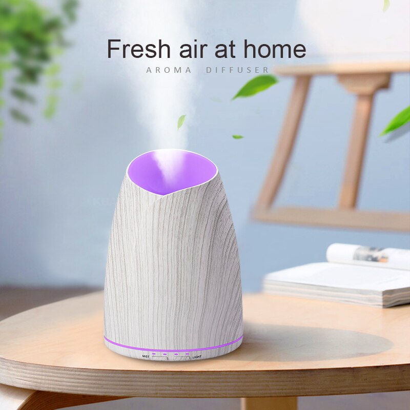 Aroma diffuser on a table with 'Fresh air at home' text and a blurred background