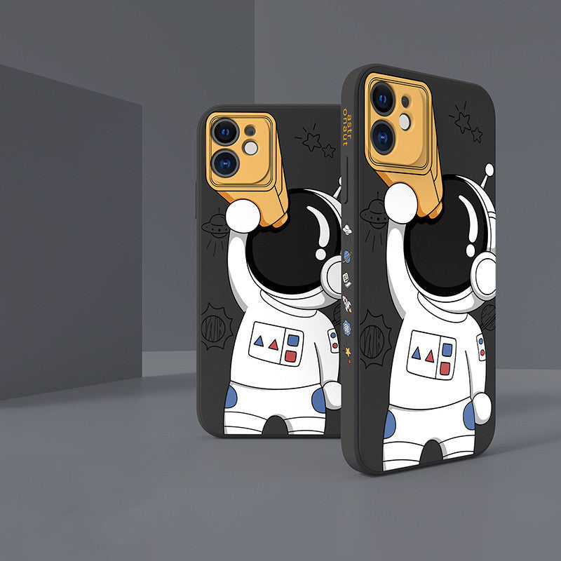 Two phone cases with astronaut designs on a dark background