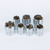 Set of seven metallic sockets on a white background