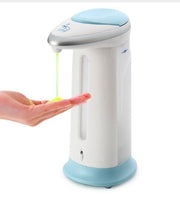 Hand pressing a soap dispenser with a white and blue design on a white background