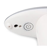 Close-up of a white electronic device with a speaker grille on a white background