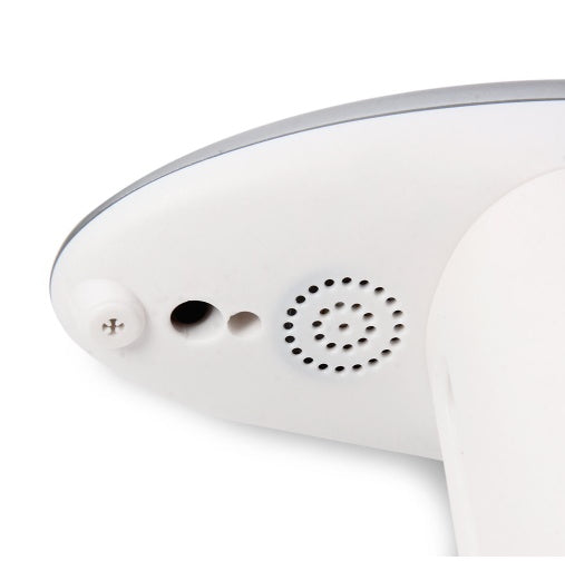 Close-up of a white electronic device with a speaker grille on a white background