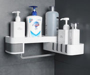 Corner wall-mounted shelf with various bottles on a gray wall background