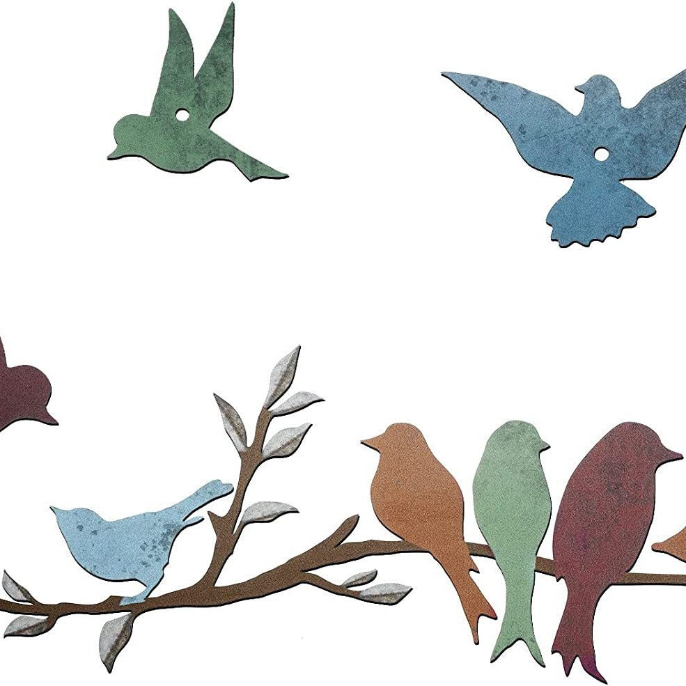 Colorful bird cutouts on a branch against a white background