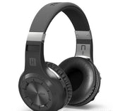 Black headphones with silver accents on a white background