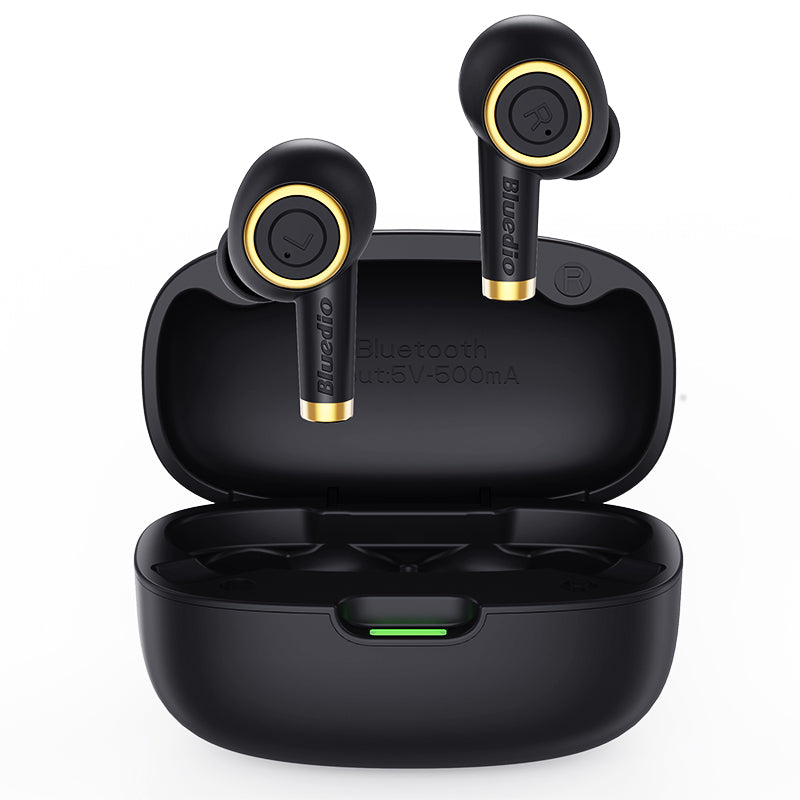 Black wireless earbuds with gold accents in a charging case on a white background