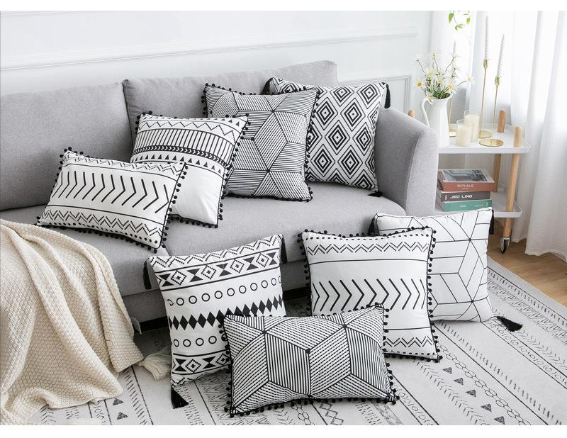 Gray sofa with patterned cushions in a living room setting