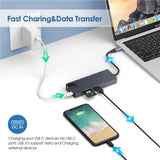 USB hub connected to a laptop and smartphone with text on fast charging and data transfer.