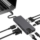 USB hub with multiple cables connected to a laptop on a white background