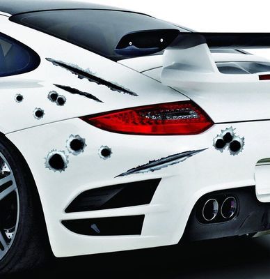 White car with bullet hole decals on a black background