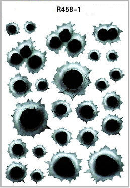 Sheet of bullet hole decals on a white background