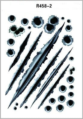 Set of black scratch and bullet hole decals on a white background