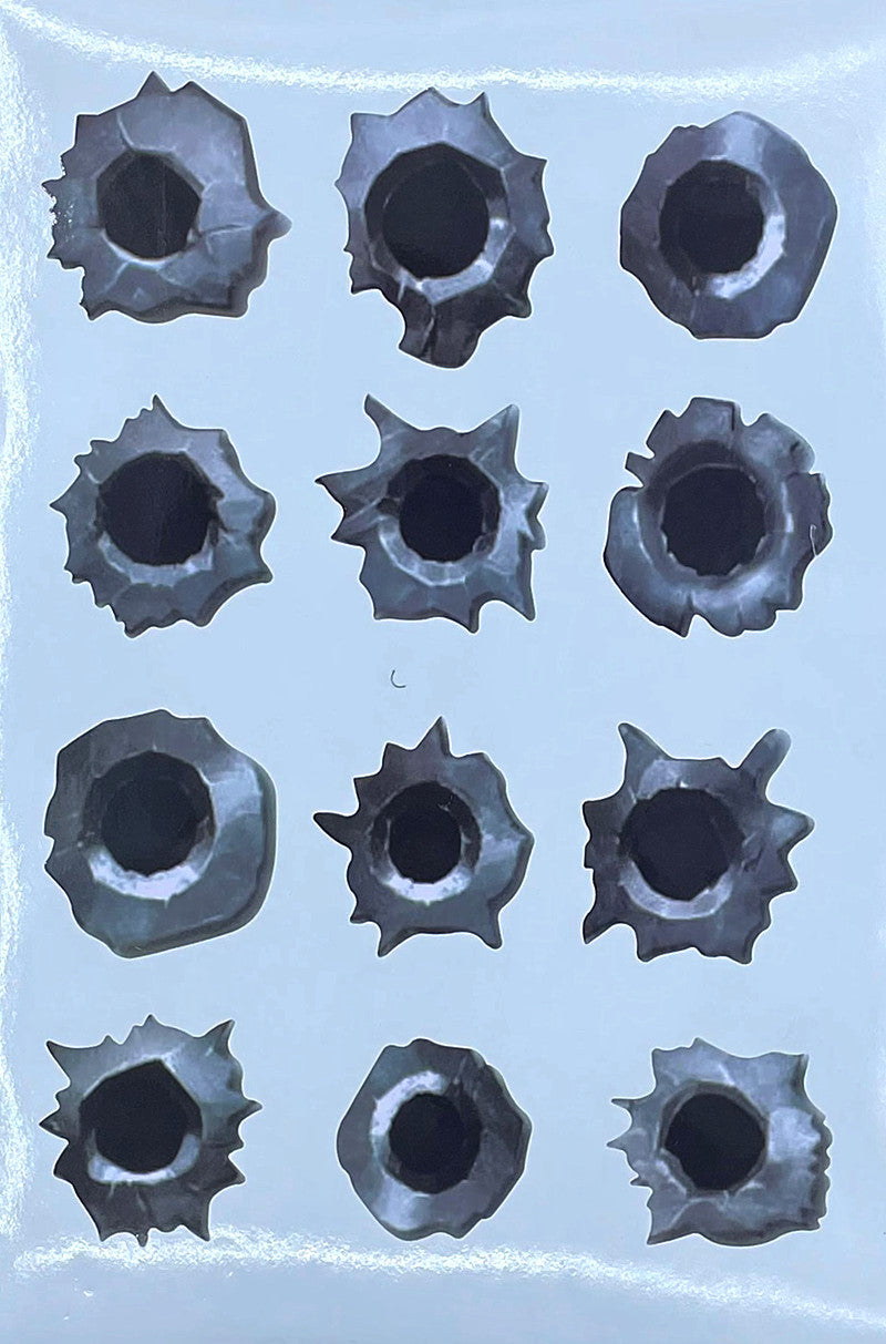 Sticker with bullet hole designs on a clear background
