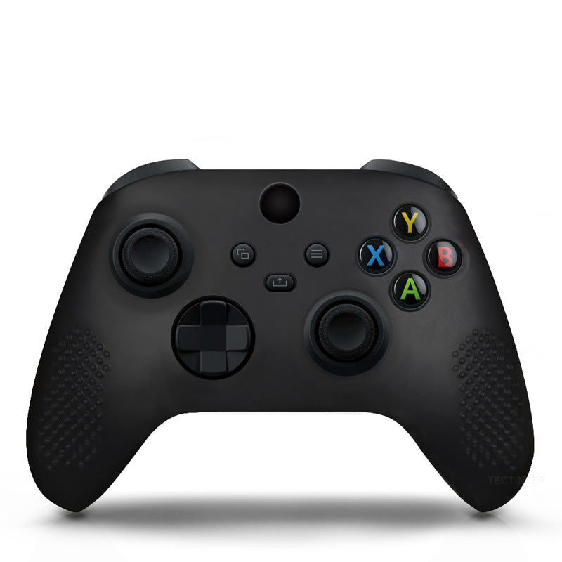 Black gaming controller on a white background
