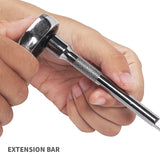 Hand holding a metal extension bar with a white background