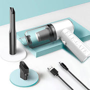 White handheld vacuum cleaner with attachments on a light blue background