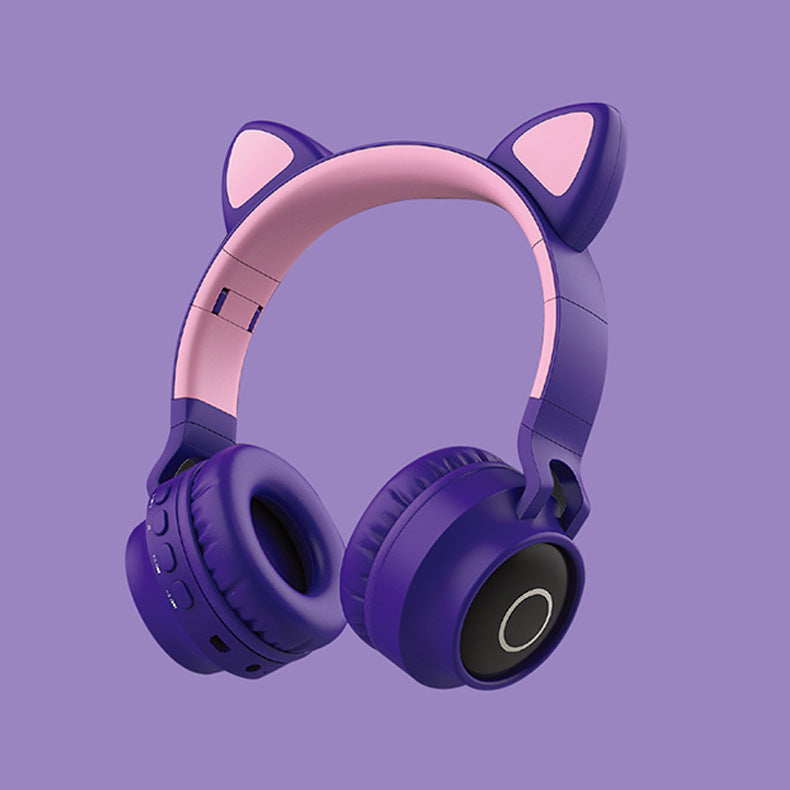 Purple headphones with cat ears on a purple background