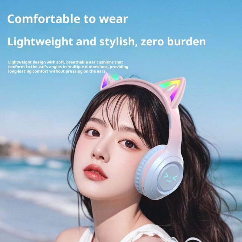 Person wearing cat ear headphones with a scenic background