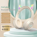 Cat ear Bluetooth headset with RGB lighting on a stand against a light blue curtain background
