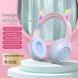Pink Bluetooth headset with cat ears on a pink background